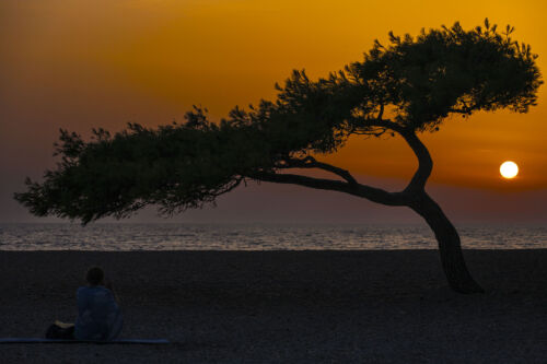 Solitude at Zlatni Rat: A Breathtaking Sunset Captured in Timeless Photo Art