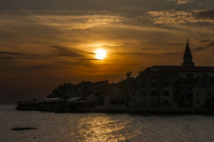 As the sun sets over the ancient town of Umag