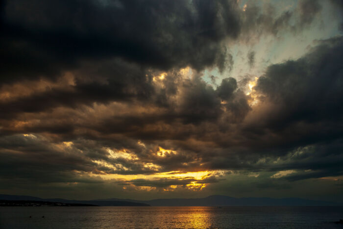 Tempest's Gold: Malinska's Majestic Skies Captured in Breathtaking Photo Art