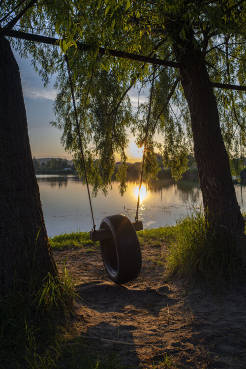 Whispers of Nostalgia: A Lakeside Sunset Captured in Timeless Photo Art